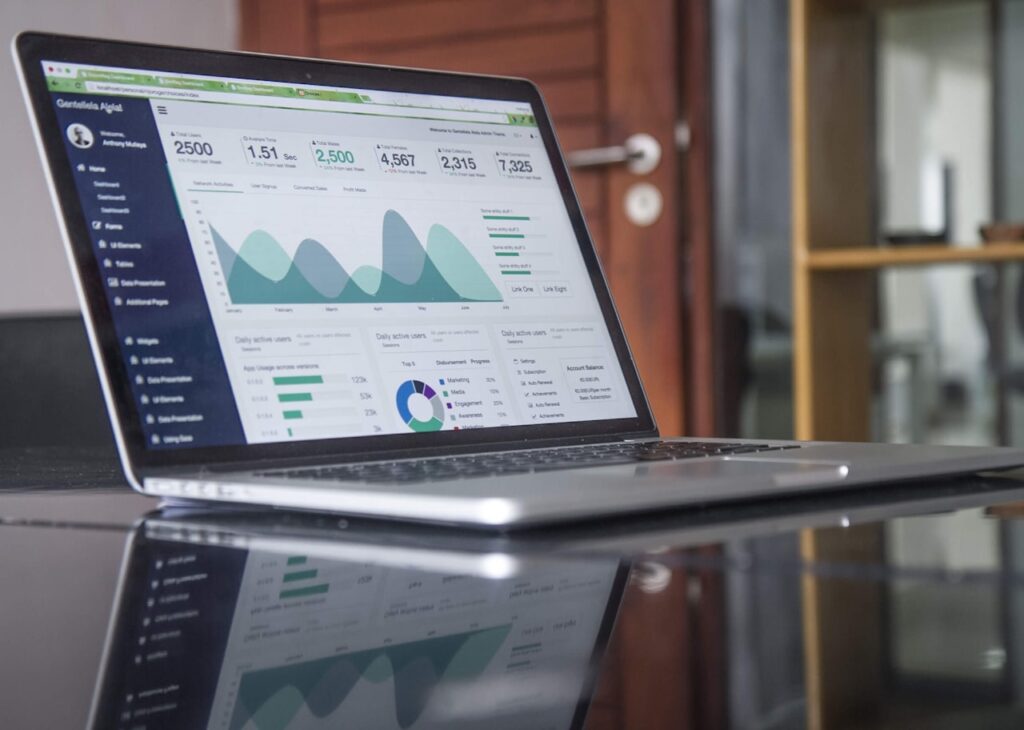 Digital marketing concept with laptop, smartphone, and marketing icons representing various digital channels